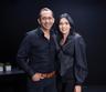 Ritesh and Dimple Bawri, founders of nira kitchen, photographed against a charcoal studio backdrop